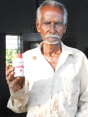 Subramanya from Madurai uses monocrotophos pesticide
as suggested by agricultural colleges. It is banned for use
on vegetables (Photo: Megha Prakash) Subramanya from Madurai uses monocrotophos pesticide
as suggested by agricultural colleges. It is banned for use
on vegetables (Photo: Megha Prakash)