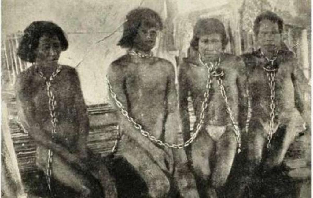 A photo of enslaved Amazon Indians during the rubber boom of the early 1900's from the book, The Putumayo: The Devil's Paradise (Photo credit: Walter Hardenberg, via Wikimedia Commons)