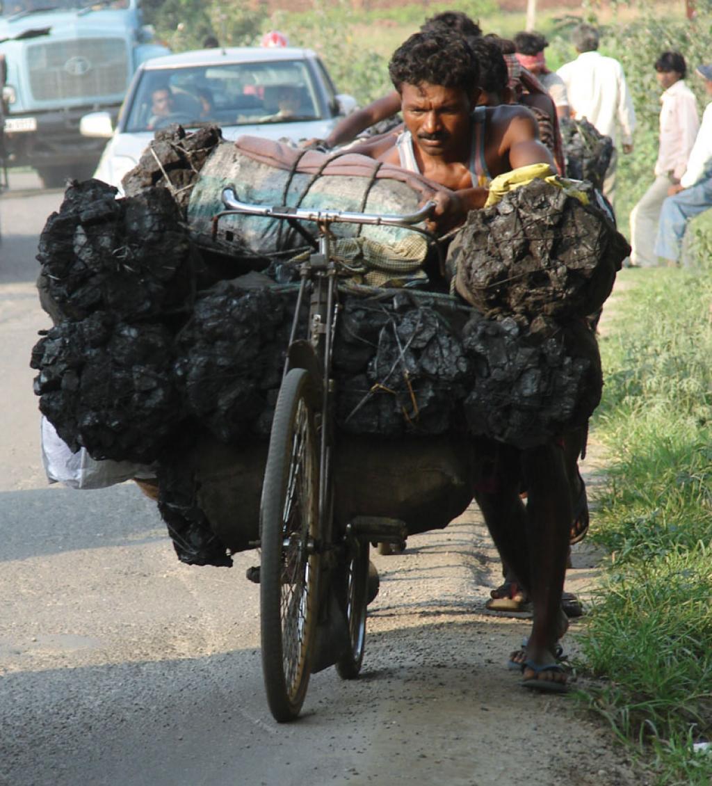 A man carries coal from coalmining
area Hazaribagh to
Ranchi. Increase in coal-based
power may be slower than
currently expected (Photo: Sugandha Juneja)