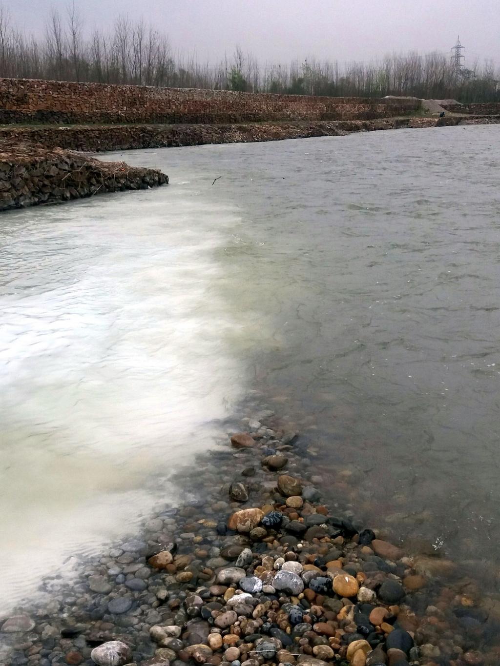 Polluted water (white in colour) of the Subhan Khawar converges into Kabul river at Shabqadar Tehsil of Charsadda district. Credit: Adeel Saeed Polluted water (white in colour) of the Subhan Khawar converges into Kabul river at Shabqadar Tehsil of Charsadda district. Credit: Adeel Saeed