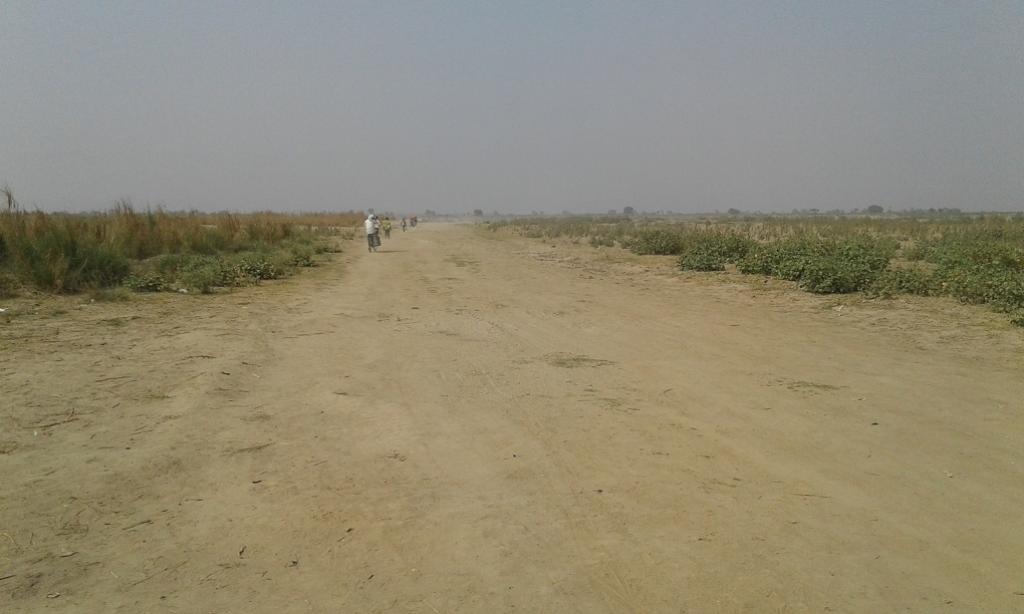 With no river for boats to operate on, villagers living on riverine islands now have to cycle or walk great distances. Credit: Mohd Imran Khan With no river for boats to operate on, villagers living on riverine islands now have to cycle or walk great distances. Credit: Mohd Imran Khan