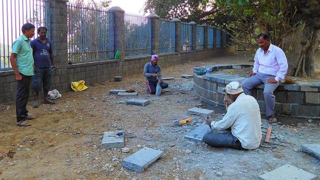 ASI monument attendant Vikas Shinde (seated) and Vishnu Rawool (in a green shirt) overseeing the Wadar tribals at work on Elephanta Island as they re-create history. Photo: Gajanan Khergamker