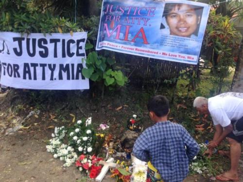 Mourners lay flowers for Mascariñas-Green on Feb. 18. According to her family, “thousands of people from all walks of life – the fishers, farmers, tricycle drivers, community workers, public servants, civil society members, religious groups, the young and old, men and women,” paid their respects. Photo courtesy of LezGrIB New Gen Unlimited Mourners lay flowers for Mascariñas-Green on Feb. 18. According to her family, “thousands of people from all walks of life – the fishers, farmers, tricycle drivers, community workers, public servants, civil society members, religious groups, the young and old, men and women,” paid their respects. Photo courtesy of LezGrIB New Gen Unlimited